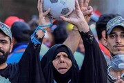 ببینید | تصویری از زن عراقی که به خاطر برد عراق مقابل ایران، جهانی شد!