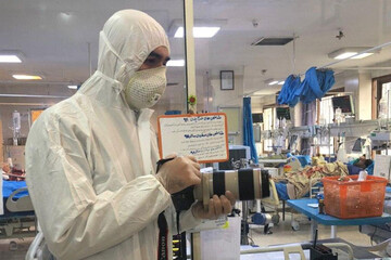 ببینید | پوشش جالب عکاس بیماران قرنطینه کرونا که نخستین تصاویر از بیمارستان مسیح دانشوری را منتشر کرد