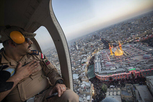 عکس | ادای احترام فرمانده نظامی عراقی بر فراز بین‌الحرمین