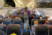 ببینید | خوشحالی مسافران پرواز آمریکا از ماسک نزدن در هواپیما