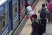 ببینید | نجات معجزه آسای زنی که زیر قطار افتاد