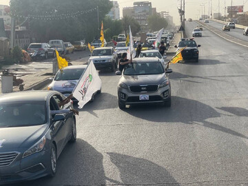 جشن و شادمانی ساکنان بغداد در سالگرد تأسیس الحشد الشعبی
