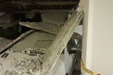 عکس | خسارت شدید به پژو ۲۰۶ در پارکینگ؛ انفجار ساختمان مسکونی در تهران 