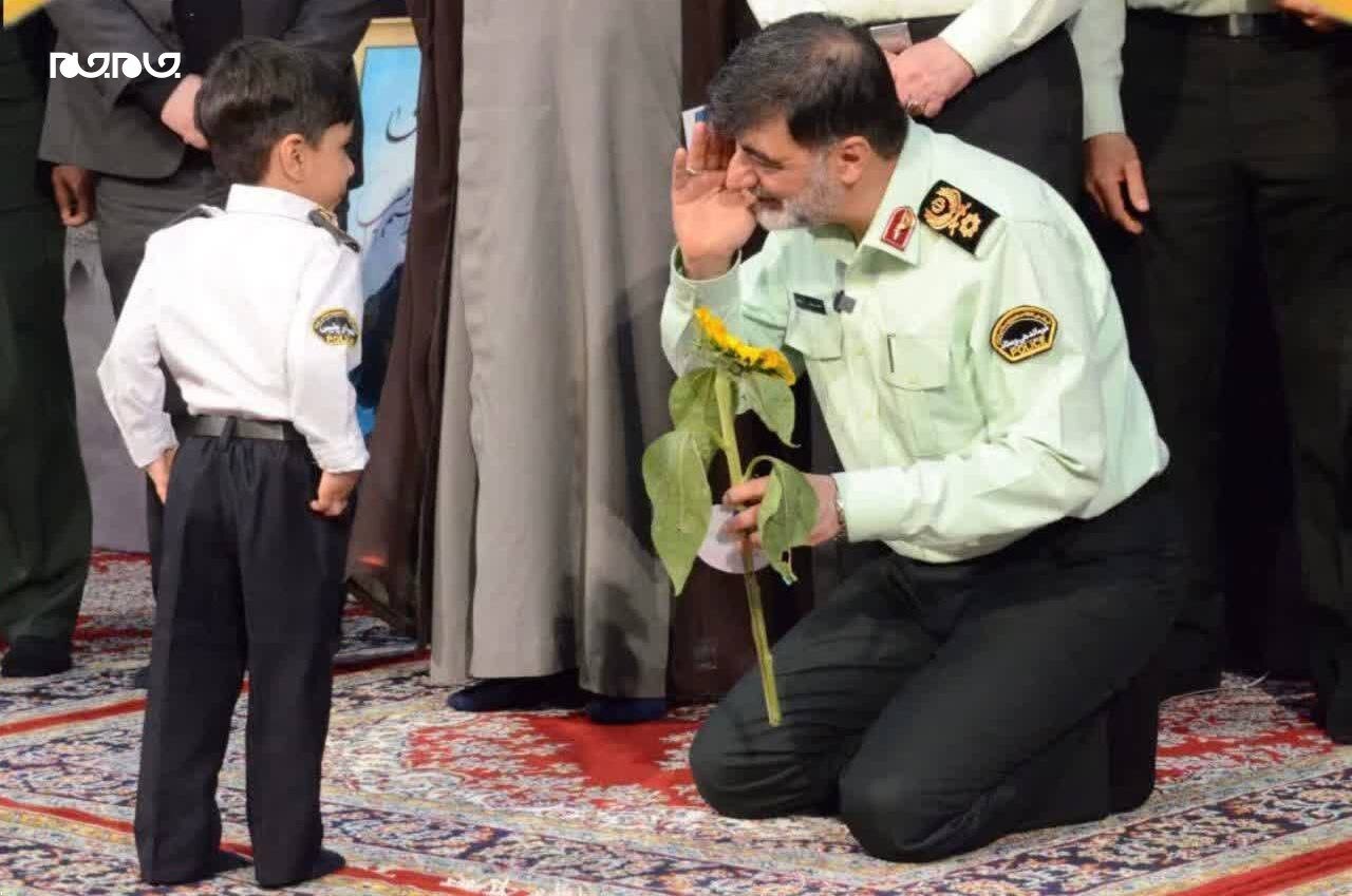 عکس | ادای احترام سردار رادان به فرزند شهید باغبان‌زاده‌