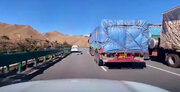 ببینید | لحظه نجات راننده خودروی سواری از تصادف شدید حین سبقت