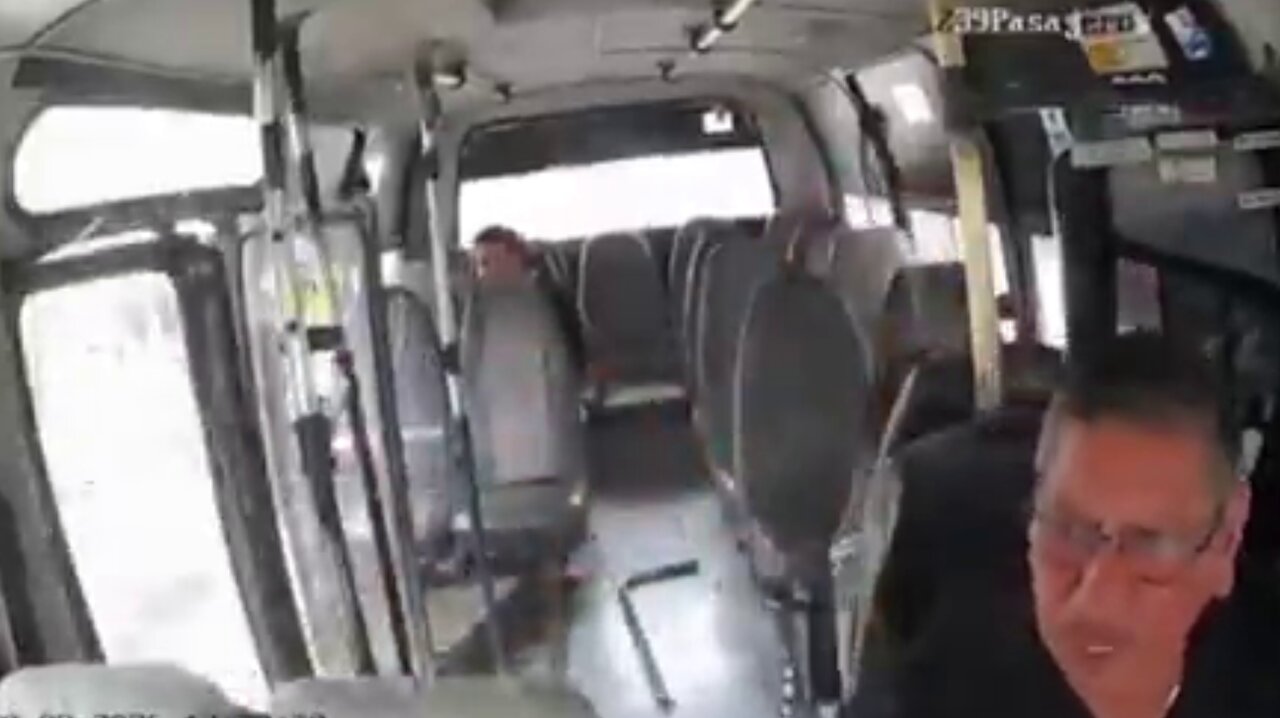 Motorcyclist Survives Collision After Being Thrown Through Open Minibus Door