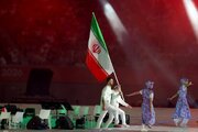 ببینید | پرچمداری زهرا کیانی و فاضل اتراچال در رژه کاروان ایران در افتتاحیه